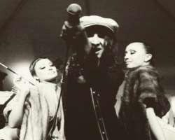 He is known for his unusual style of hip-hop and openly sexualized image, his music themes features seduction and sexual encounters with women.